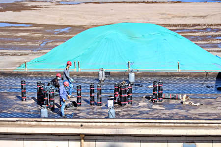 Jinzhou, China, September 18,2020. Cargo terminal for unloading bulk cargoes by shore cranes and grabs. Views of cargo equipment for discharging of bulk cargoes.のeditorial素材