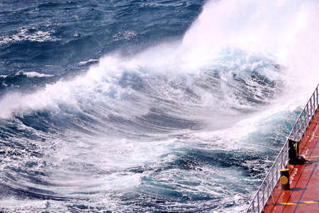 Storm waves in the world ocean. Kind of waves, crests, splashes, foam against the background of the...