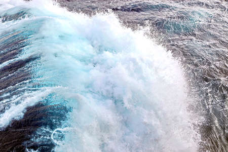 Storm waves in the world ocean. Kind of waves, crests, splashes, foam against the background of the...