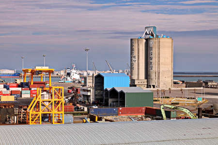 Port of Taichung, Taiwan, September, 24,2020. Cargo terminal for unloading bulk cargoes by shore...