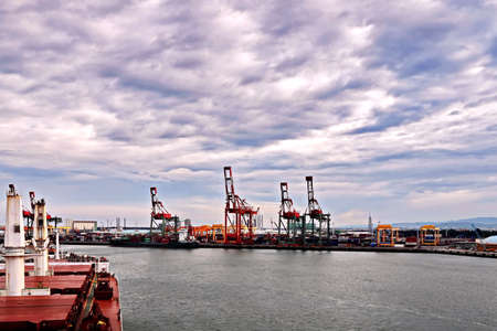 Port of Taichung, Taiwan. September, 24, 2020. Container terminal and vessels at the port while cargo operations and underway.のeditorial素材
