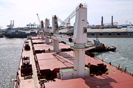 Port of Taichung, Taiwan. September, 24, 2020. Seagoing vessels, tugboats at the port under cargo...