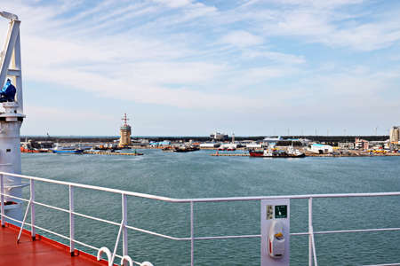 Port of Taichung, Taiwan. September, 24, 2020. Seagoing vessels, tugboats at the port under cargo operations and underway.のeditorial素材