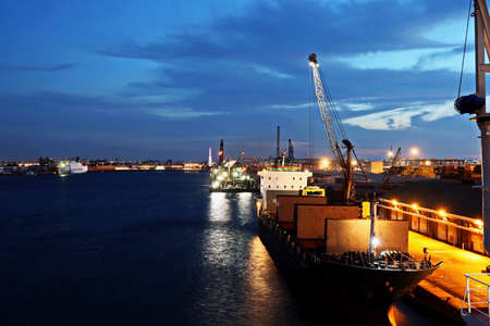 Port of Taichung, Taiwan. September, 24, 2020. Seagoing vessels, tugboats at the port under cargo operations and underway.のeditorial素材