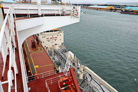 Port of Taichung. Taiwan, September, 24, 2020. Bunkering operations at the port. Bunker barge alongside of vessel and underway.のeditorial素材