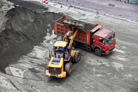 Fangcheng, China, September 30,2020. Cargo terminal for unloading bulk cargoes by shore cranes and grabs. Views of cargo equipment for discharging of bulk cargoes.のeditorial素材