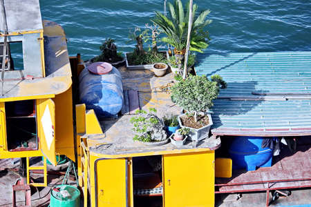 Close-up views of equipments, constructions of vessel, barges, tugboats and small boats at the roadstead of Halong bay. Port of Campha, Vietnam, October, 2020の写真素材