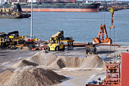 Paradeep, India, October, 21, 2020. Cargo terminal for unloading bulk cargo of limestone by shore cranes and grabs.のeditorial素材