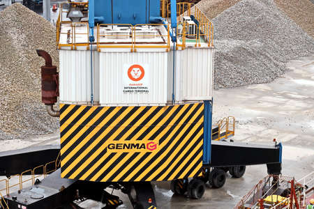 Paradeep, India, October, 21, 2020. Cargo terminal for unloading bulk cargo of limestone by shore cranes and grabs. Views of cargo equipment for discharging of bulk cargoes.のeditorial素材