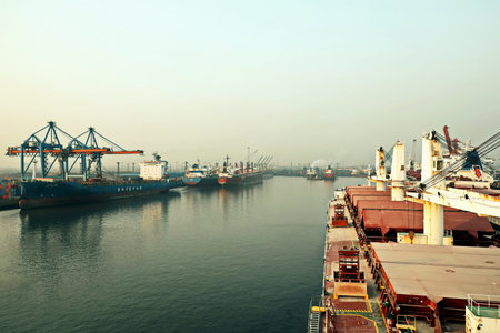 Haldia, India, October, 27, 2020. Seagoing vessels, tugboats at the port under cargo operations and...