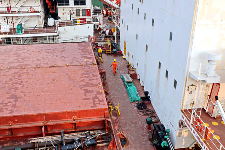 Haldia, India, October, 27, 2020. Cargo terminal for unloading bulk cargo of limestone by shore cranes and grabs. Views of cargo equipment for discharging of bulk cargoes.のeditorial素材