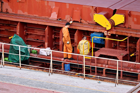 Haldia, India, October, 27, 2020. Cargo terminal for unloading bulk cargo of limestone by shore cranes and grabs. Views of cargo equipment for discharging of bulk cargoes.のeditorial素材