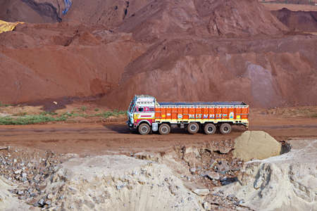 Gopalpur, India, November, 03-05, 2020. Cargo terminal for loading bulk cargo of iron ore by ship cranes and grabs. Views of cargo equipment for discharging of bulk cargoes.のeditorial素材