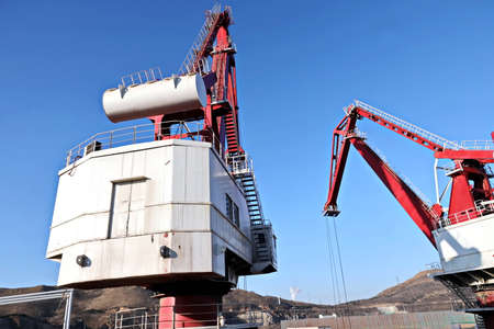 View of onshore harbor cranes and their structures in the port of Huludao, China.