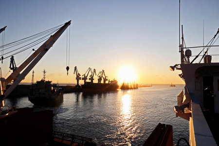 Various sunset views of the docks, piers, terminal of the Port of Huludao, China.の写真素材