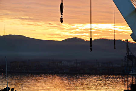 Various sunrise views of the piers, terminal and coastline of the Port of Vostochnyy. Russia, December, 2020の写真素材