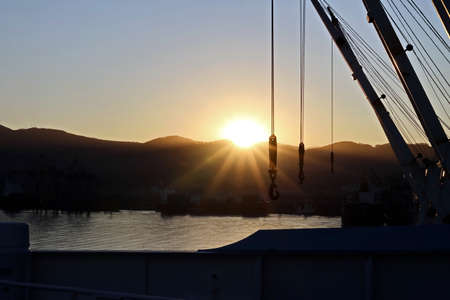 Various sunrise views of the piers, terminal and coastline of the Port of Vostochnyy. Russia, December, 2020の写真素材