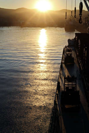 Various sunrise views of the piers, terminal and coastline of the Port of Vostochnyy. Russia, December, 2020の写真素材