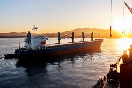 Various sunrise views of the piers, terminal and coastline of the Port of Vostochnyy. Russia, December, 2020の写真素材