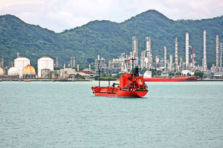 Vessels, bulk carrier and tugboats at the port under cargo operations and underway. Port of...