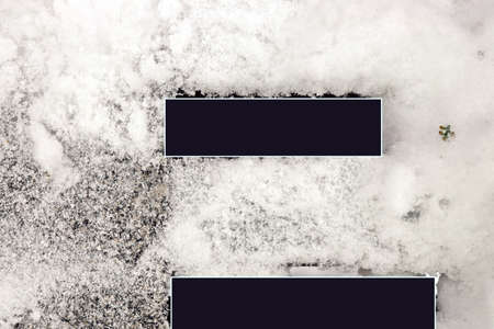 Winter and snow. Wooden boards and trunks covered with snow and ice as a base and background....