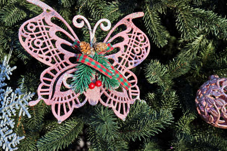 Christmas tree decorations and toys for fir trees covered with snow and ice. Close-up. Happy New Year and Merry Christmas.の写真素材