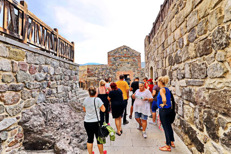 Khertvisi, Georgia 31, July, 2019 . Tourists the visiting sights of the fortress, buildings and castle of Khertvisi.のeditorial素材