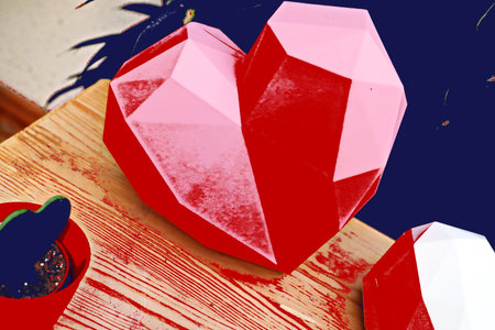 Valentine's Day background. Red heart on wooden table.