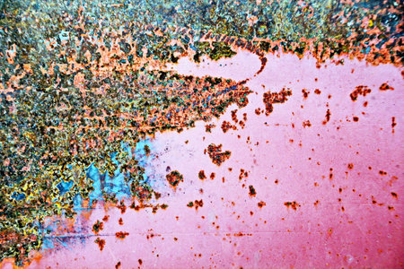 abstract background of rusty metal with spots of paint and different colorsの写真素材