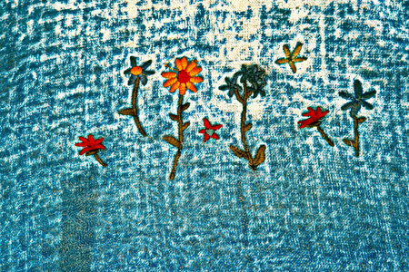 flower embroidery on fabric for background, closeup of photoの写真素材