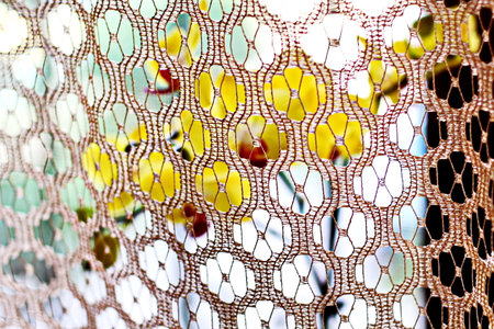 abstract background made of lace fabric, closeup of photo.の写真素材