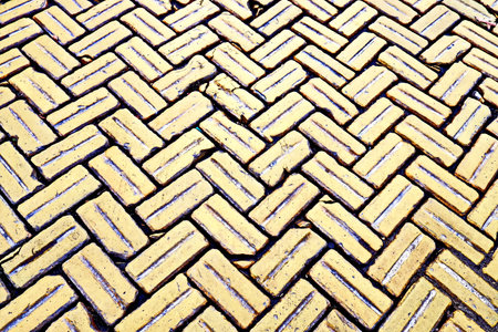 abstract background of a cobblestone pavement in the old townの写真素材