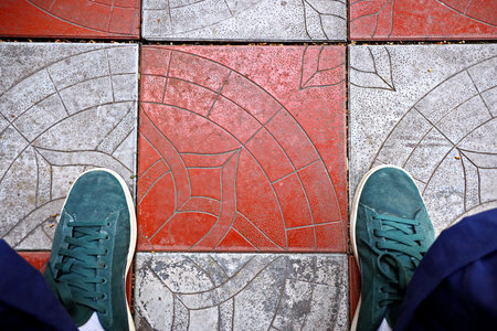 Pair of shoes standing on the floor, closeup of photoの写真素材