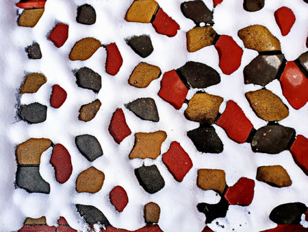 abstract background texture of a stone wall with red and brown stonesの写真素材