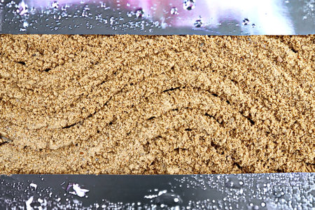 Coffee crumble on a metal background. close-up.