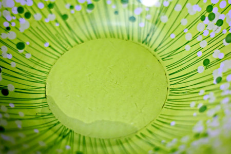 Green paper with flower pattern in the form of a circle. abstract background.の写真素材