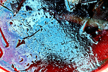 Water drops on a glass with ice. Abstract background for design.の写真素材