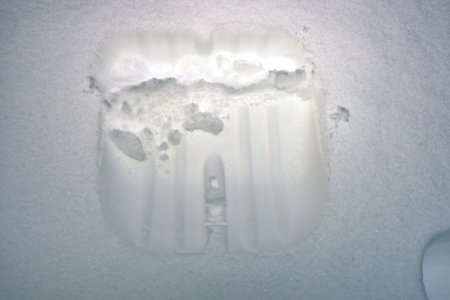Melting ice on a frozen window in winter. Ice float.の写真素材