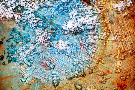 abstract background - rusty metal plate covered with hoarfrost and snowの写真素材
