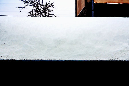 Snow on the roof of a house in winter. snowdrift.の写真素材