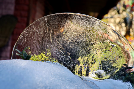 Frosty window of a car covered with snow and ice.の写真素材