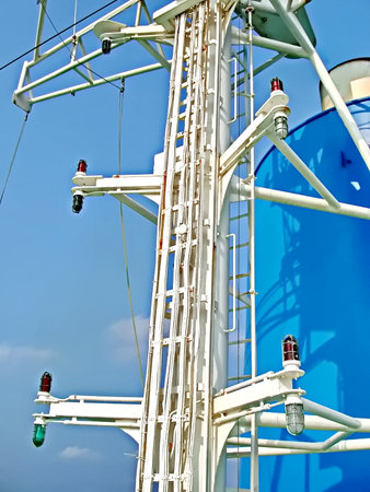 Detail of a power transmission tower on a cruise ship, blue sky background