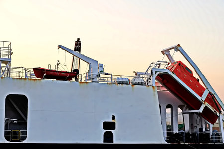Cargo ship on the dock in the evening, close-up