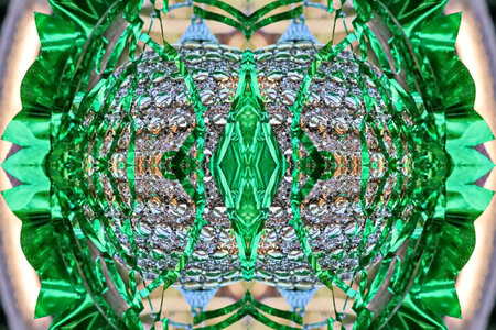 abstract background with green and white kaleidoscope ornamentsの写真素材