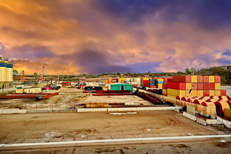 Cargo containers in the port at sunset. Cargo freight transportation.の写真素材