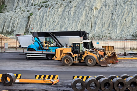 Construction of a new road in the mountains. Road construction equipment.