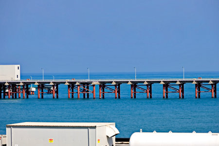 Pier in the sea, blue sky and white clouds in summerの写真素材