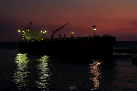Cargo ship in the port of Odessa at sunset, Ukraineの写真素材
