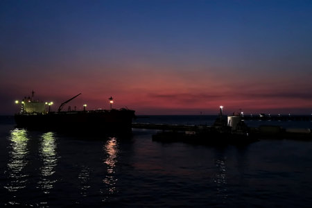 Cargo ship in the sea at sunset. Night view of cargo ship.の写真素材