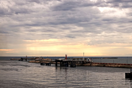 Sunset on the pier of the Baltic Sea in Kolobrzeg, Polandの写真素材
